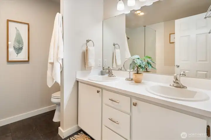 The primary suite’s five-piece bathroom is the end-all-be-all of comfort.