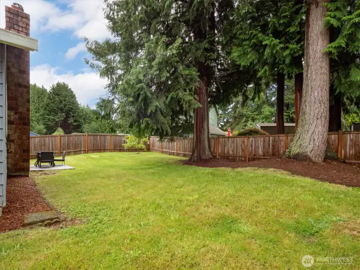 Entertain guests or ideas on the fully fenced backyard.