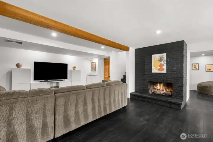 Enjoy a warm, inviting rec room with a gas fireplace plus bonus finished space for added versatility Enjoy a warm, inviting rec room with a gas fireplace plus bonus finished space for added versatility