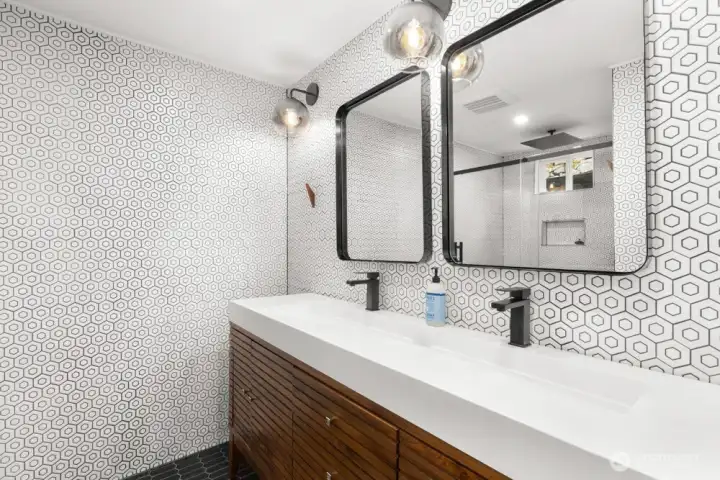 Floor-to-ceiling modern tile surround with an easy walk-in shower creates a clean, spa-like feel. Floor-to-ceiling modern tile surround with an easy walk-in shower creates a clean, spa-like feel.