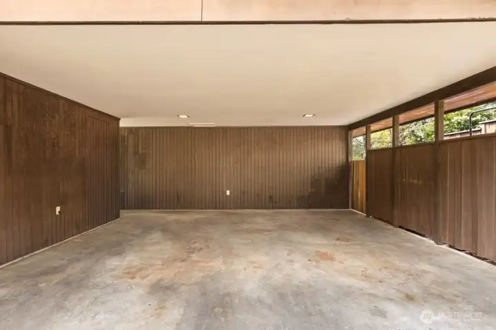 Clean carport with additional storage space. Clean carport with additional storage space.