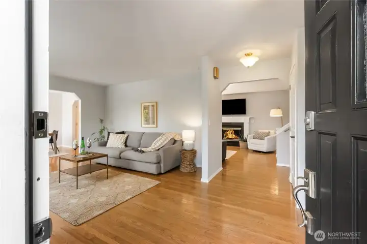 Enter into your bright living room with hardwood floors