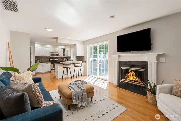 Informal living room with gas fireplace and access to backyard