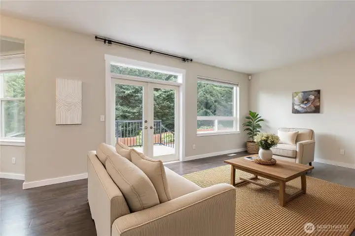 Family room offers backyard access with beautiful French doors
