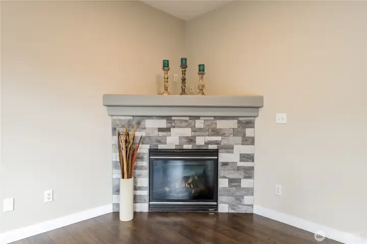 Cozy up in the family room next to the beautiful corner gas fireplace.