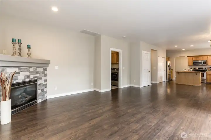 Low-maintenance LVP flooring throughout the main level provides both style and durability.