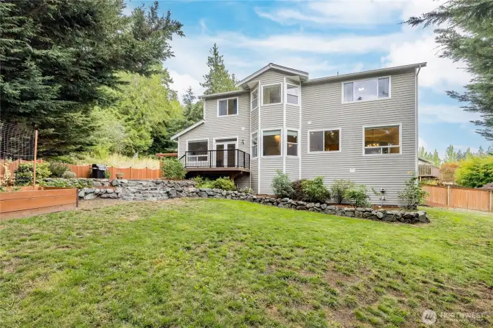 Expansive yard offers a large lawn space