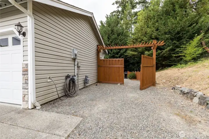 Gated RV parking with water, sewer and 50A hookups!