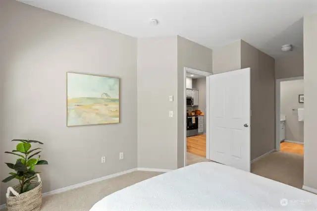 The primary bedroom is separate from the second bedroom for additional privacy.