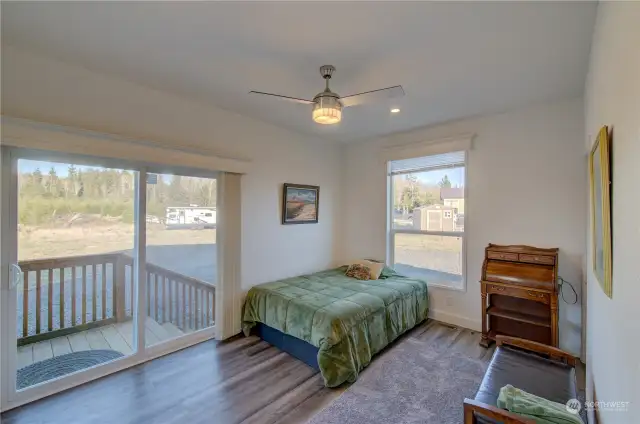 Guest bedroom has huge closet and nice view.