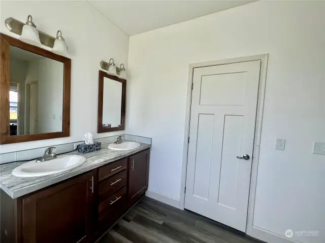 Bath features double sinks, walk in shower water closet