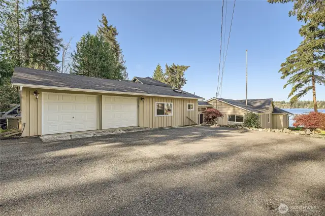 460ft (oversized) 2-car garage with large paved parking area. More parking off driveway as well.
