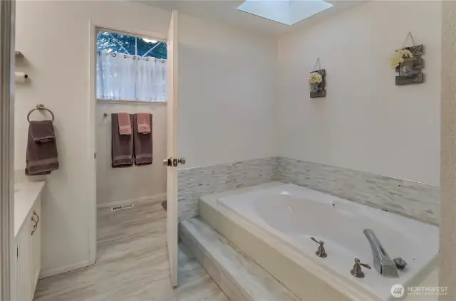 Primary bathroom soaking tub.