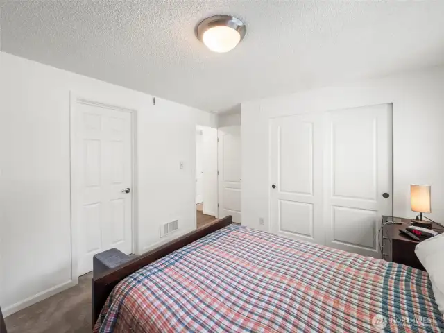 Primary Room, Left Door is the bathroom, middle is hallway, right is closet