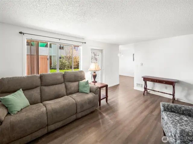 Living Room with view of Dining Room and Back Door to Porch