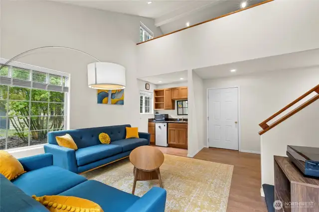 The main floor includes a spacious living area and stylish kitchenette.