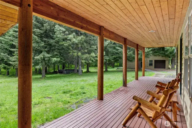 Enjoy peaceful woodland views and rustic charm from the inviting wrap-around porch.
