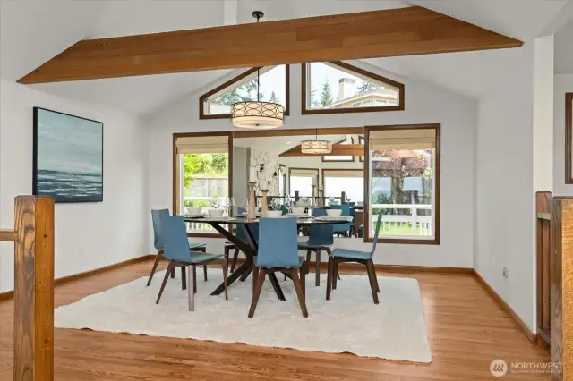 Formal dining room with large windows