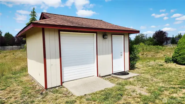 Large Garden shed with lawn tractor garage door!