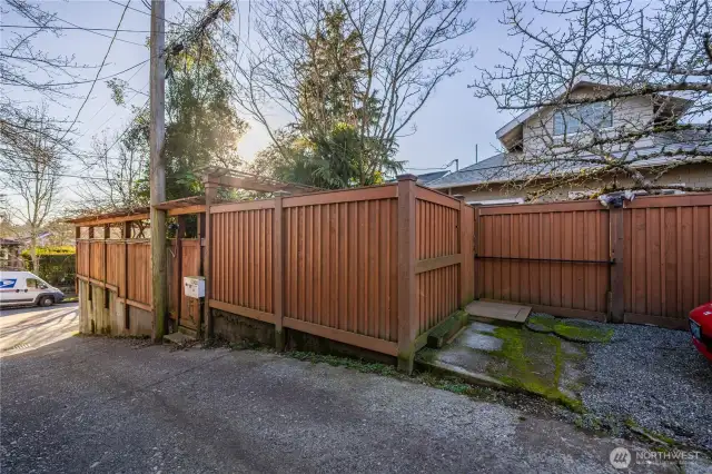 Back alley entrance with parking pad