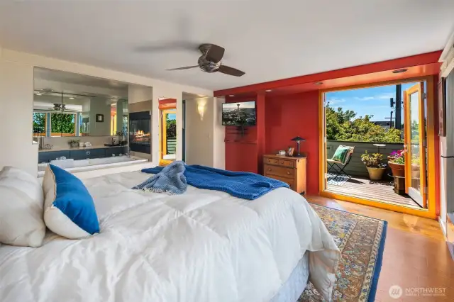 French doors off the primary bedroom lead to rooftop deck