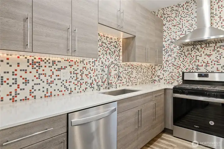 Beautiful Quartz countertops, lots of counter space, gas cooking.