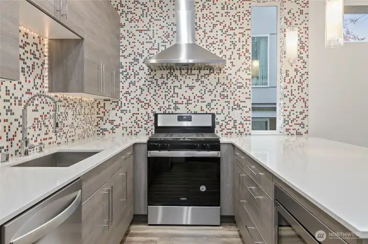 Gas cooking, soft close drawers, stainless appliances.