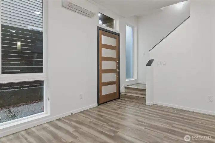 The high ceilings, and natural light from floor to ceiling windows enhance the living areas.