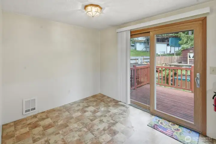 Dining area with wood slider to large deck