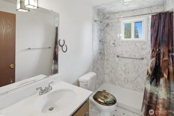 Spacious main floor bathroom with walk-in shower