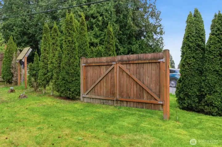 Double gate entrance into back yard from main street. Used for RV parking on back