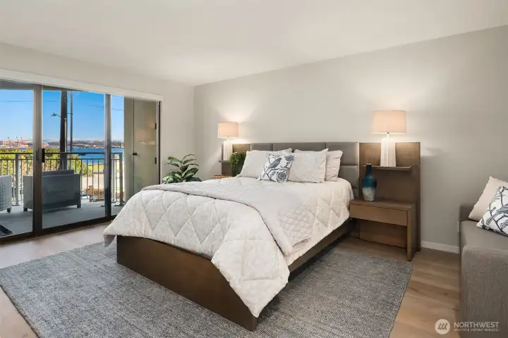 Primary bedroom with private deck and views