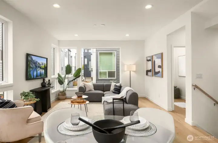 The living room flows seamlessly into the dining area, highlighting the home's thoughtful, open floor plan
