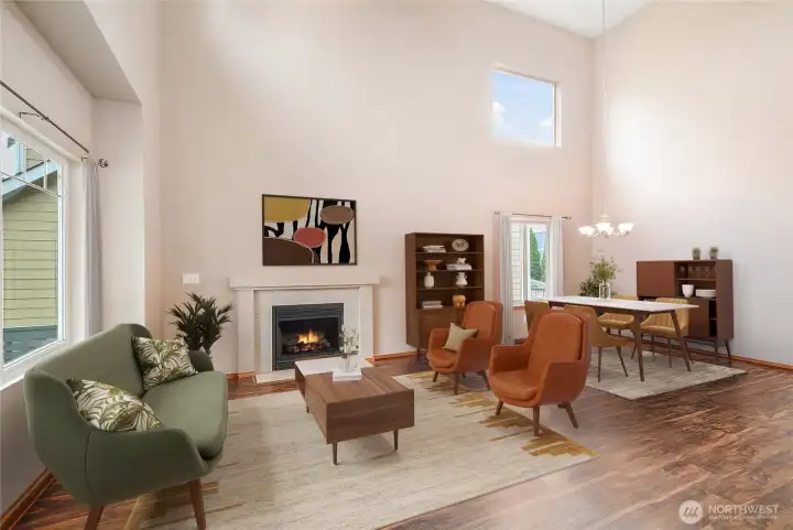 As you enter you will be greeted by a gorgeous living room and dining room!  Soaring ceilings and lots of windows.  Gas fireplace and lvp flooring add to the dramatic entry!