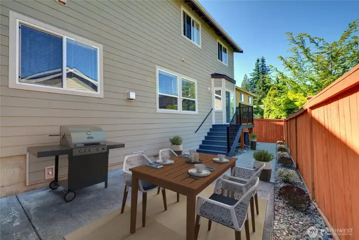 Oh the backyard!  Enjoy the sunny summer days on the patio!  Low maintenance yard is wonderful!  Newer fence with a gate on each side!