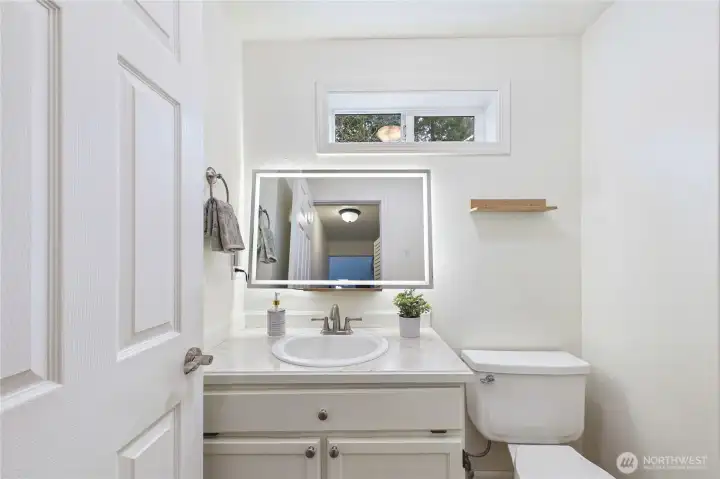 Half bath on main floor with lighted Vanity Mirror