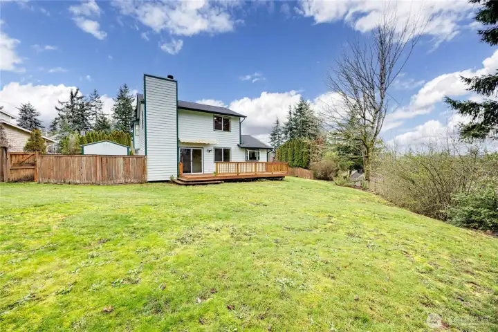 Spacious backyard - ready for gardening, games, & summertime enjoyment!