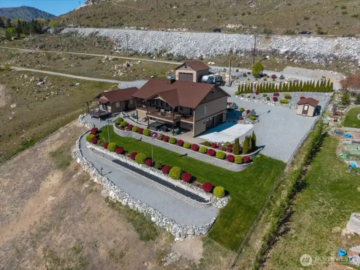 The main home and ADU/Guest House offer a unique location, just 3 miles from downtown Chelan but set on a 48,352sf landscaped site w/ grassy lawn area, terraced walls and 4-season landscaping perched above the Columbia River w/ stunning views.