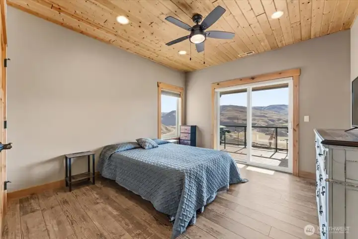 Bedroom 2 w/ solid hickory double closet doors, Milgard windows and a double glass sliding door leading to the spacious full-length deck overlooking the Columbia River