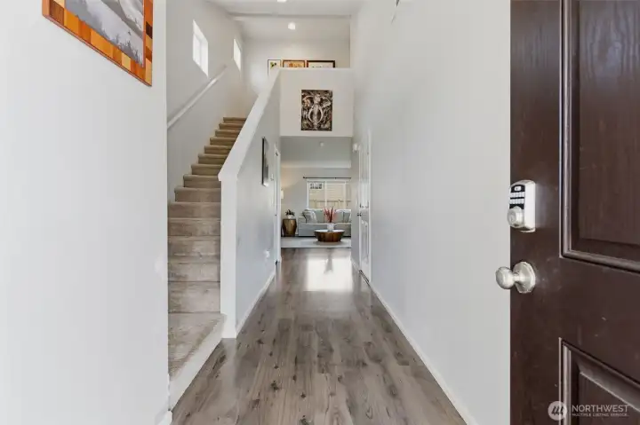 Formal entry with hallway leading to the main floor living spaces.