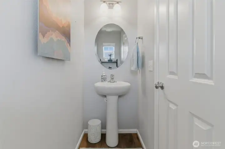 Main floor 1/2 bath with toilet and sink.