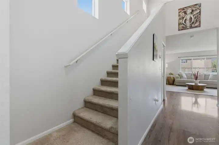 Hallway staircase leads to the second floor.