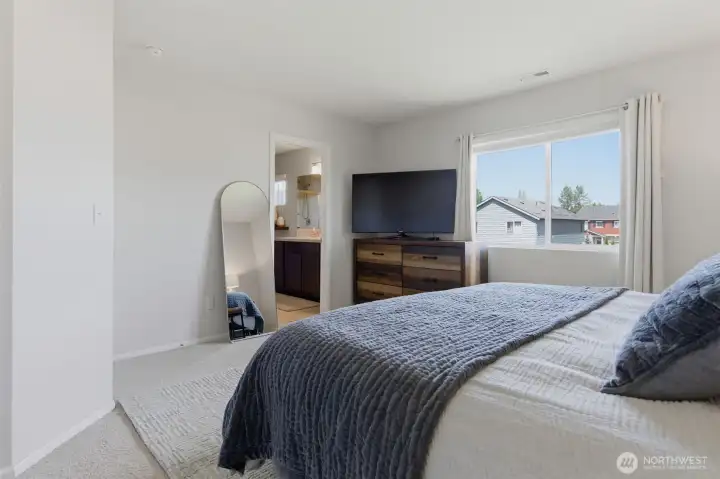 Primary bedroom with ensuite bathroom and walk-in closet.