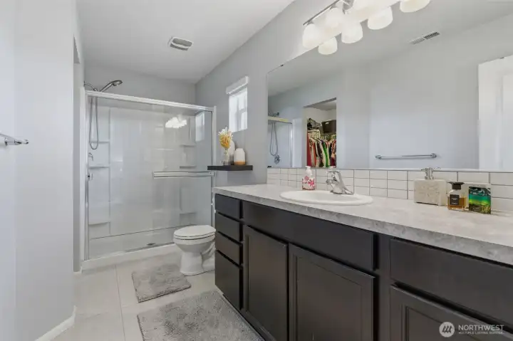 Primary ensuite bathroom with walk-in shower.