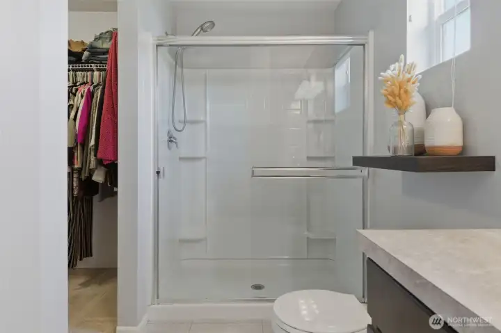 Walk-in closet entrance from the primary bathroom.