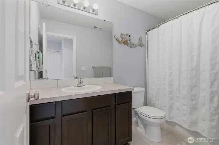 Second bathroom upstairs with bathtub/shower.