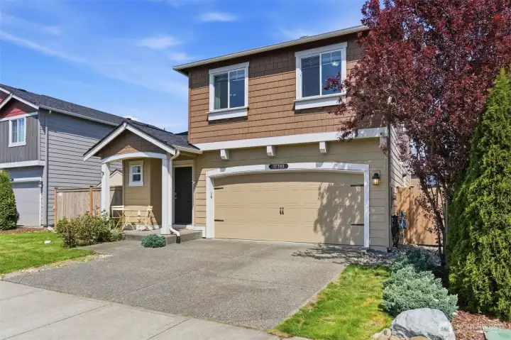 Two car garage and driveway parking.