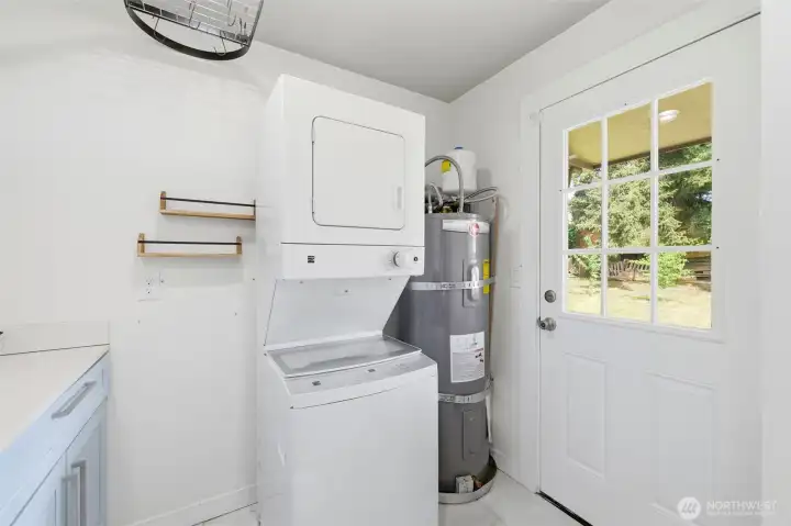 From the back of the kitchen is the laundry, newer water heater, and backyard access.