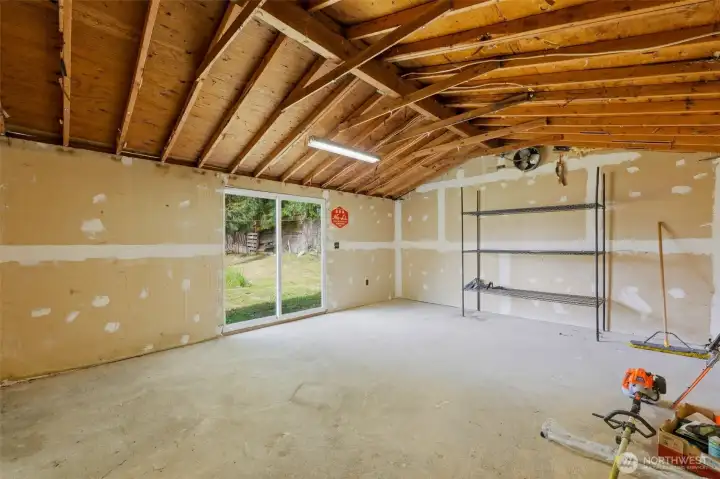 The shop area. Accessed through the slider, or back of garage.