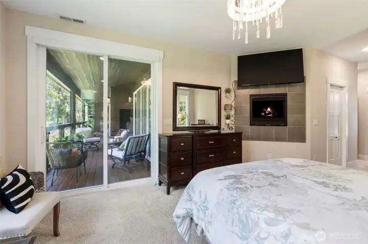 Primary bedroom leading to large balcony